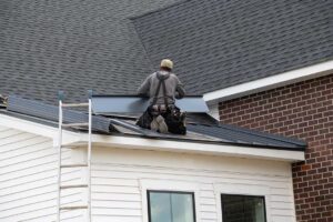 A close-up view of an asphalt shingle roof valley with visible signs of wear and missing shingles.